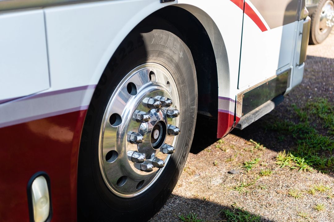 Silver Truck Tire on a White Truck